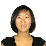 A woman with short hair is smiling for the camera.